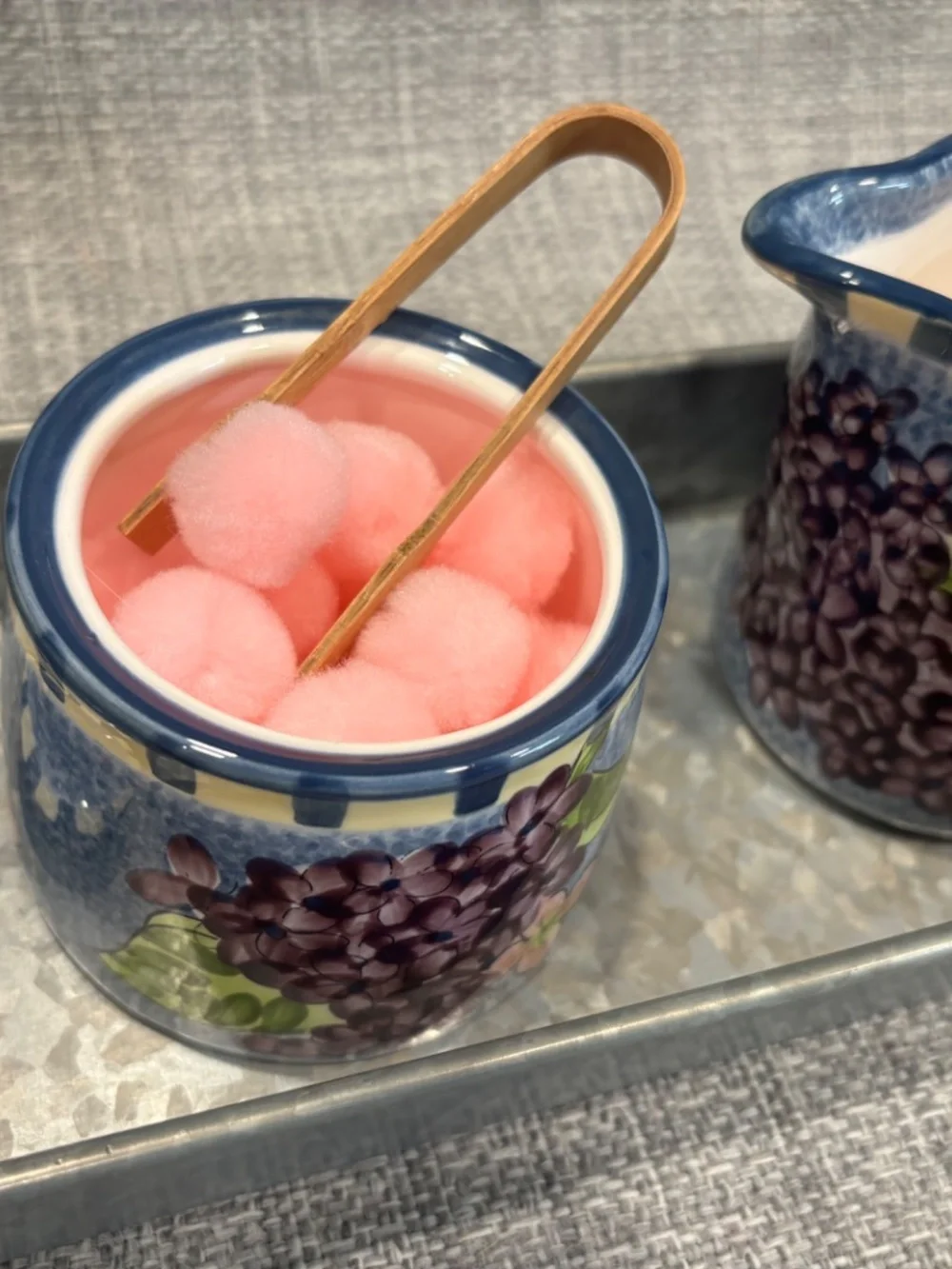 tonging and pouring pink craft poms practical extension by idlewild montessori